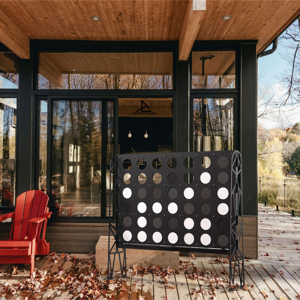 Outdoor view of a wall-mounted game with black and white circles, perfect for indoor fun during winter.