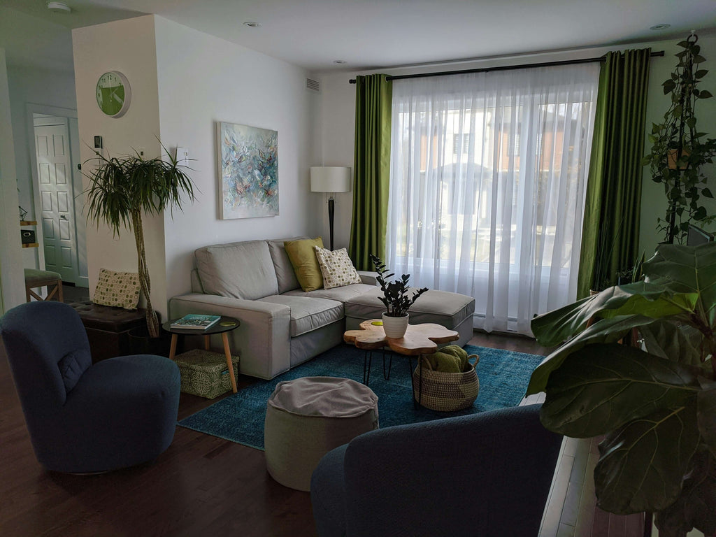 Bright and inviting living room with modern furniture, plants, and natural light, perfect for refreshing your home.