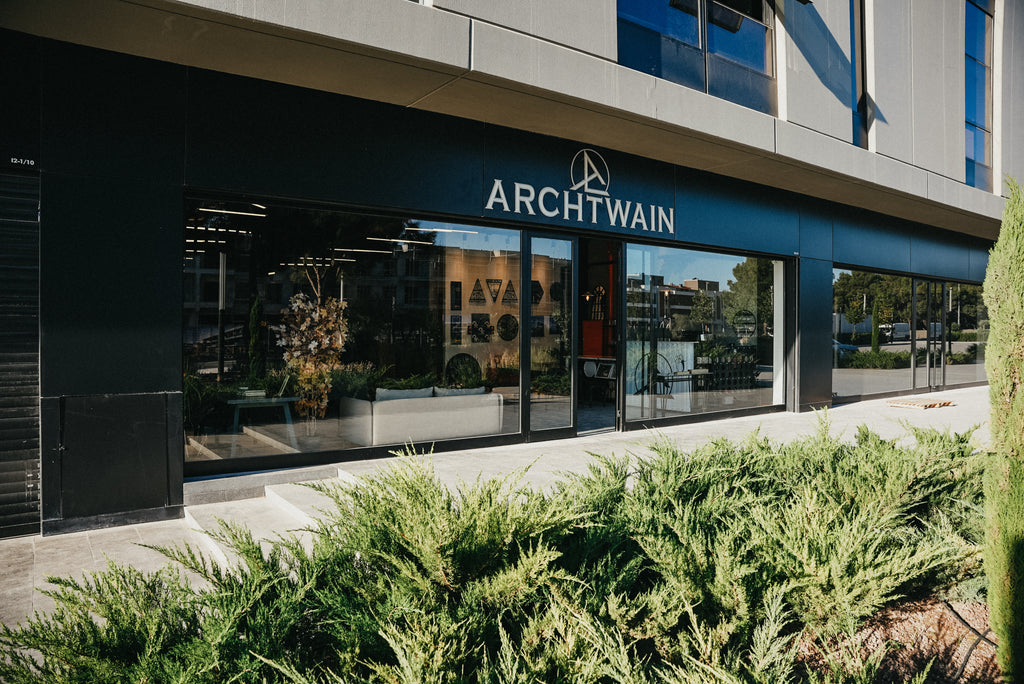 Exterior view of ARCHTWAIN store, showcasing modern design and landscaping in front.