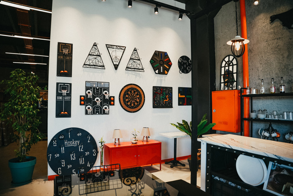 Stylish game-themed wall decor featuring various sports designs in a modern interior space.