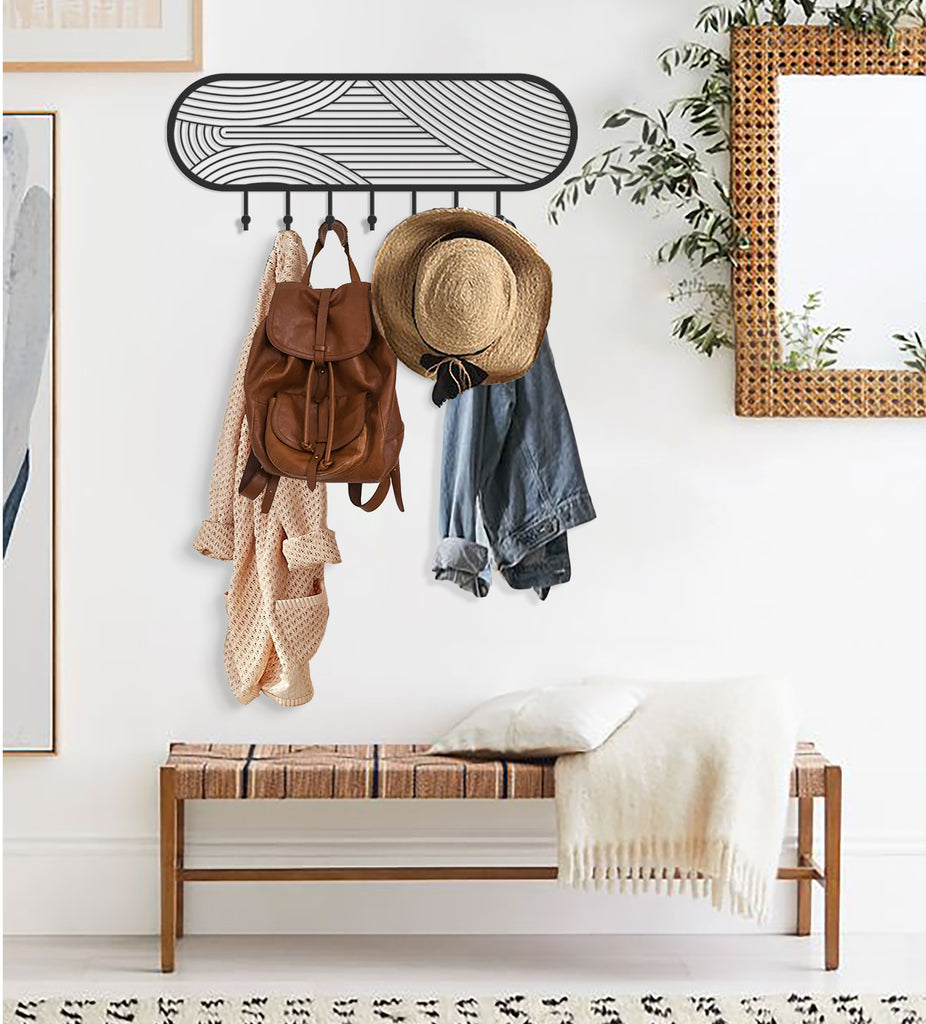 Stylish wall-mounted coat rack with hats, bags, and scarves in a modern living space.