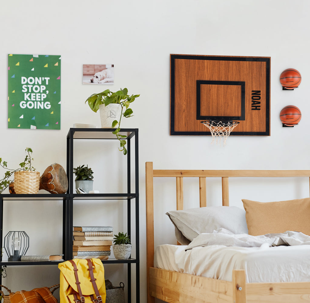 Personalized wooden wall hoop in stylish bedroom featuring motivational wall art and decor.